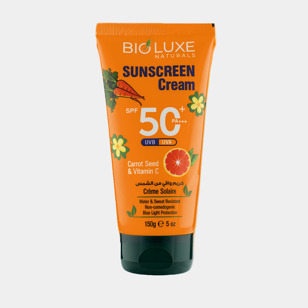 Bioluexe Naturals sunscreen cream tube on an orange background