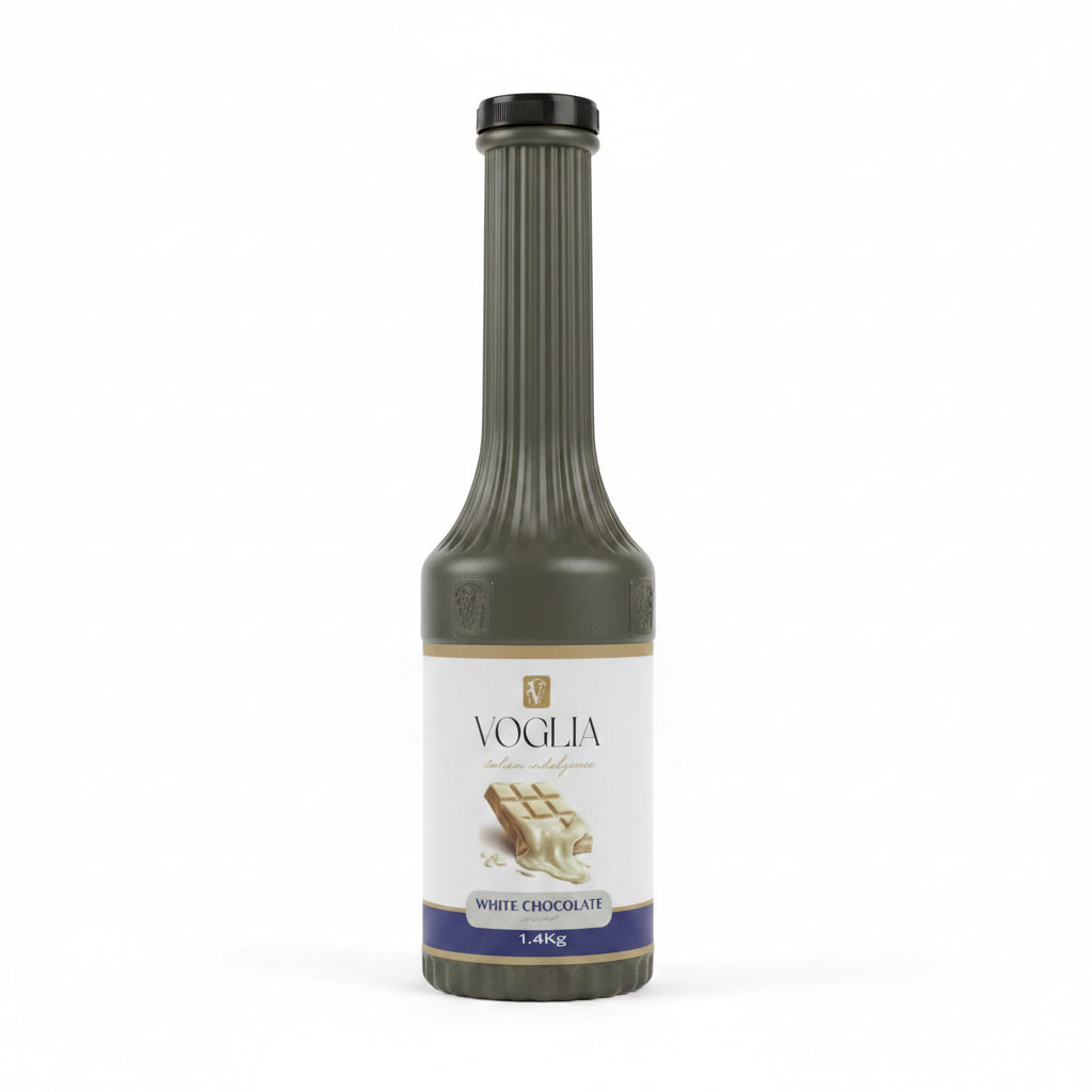 Bottle of Voglia white chocolate syrup on a table with a blurred background