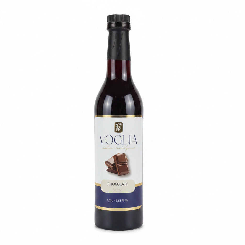 Two bottles of Voglia syrup, one salted caramel and one chocolate, on a white surface.
