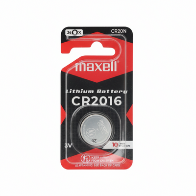 Maxell CR2016 battery in packaging on a blurred background