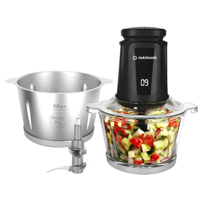 Nutricook food processor with ingredients inside on a white background
