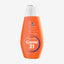 Orange bottle of Creme 21 body lotion on a light gray background