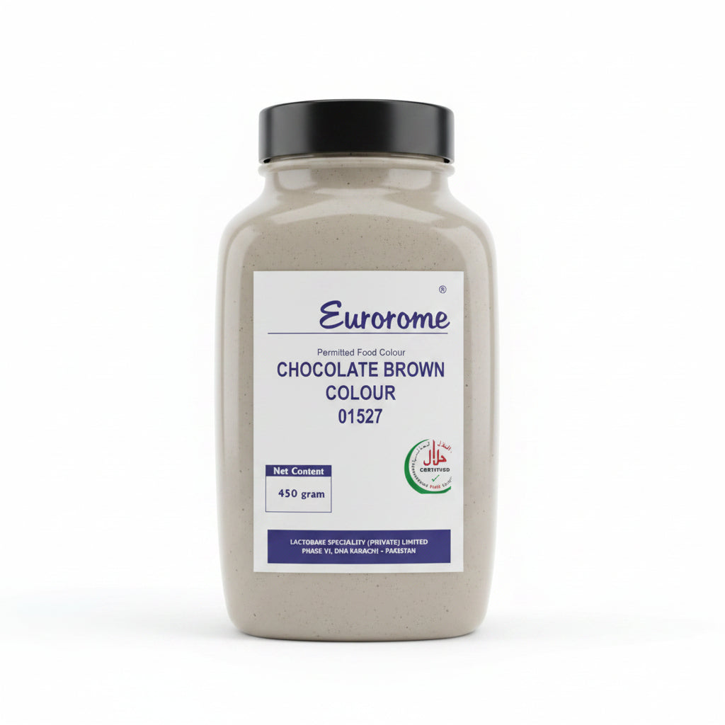 A hand holding a bottle of Eurorome Chocolate Brown Colour food coloring powder. The bottle is a translucent off-white plastic with a black cap and a white label featuring blue and green text and logos.