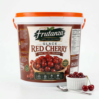 A 10 kg white plastic tub of Frutanza Glace Red Cherry fruit filling with an orange lid, shown on a white background with a small bowl of fresh cherries and a spoon in front.
