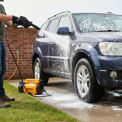Ingco pressure washer with hose and nozzle on a concrete surface