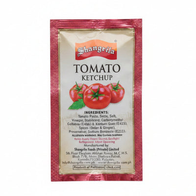 Multiple packets of Shawarma Tomato Ketchup on a blue surface