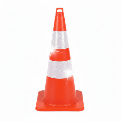 Orange traffic cone with white reflective strip held by a person indoors.