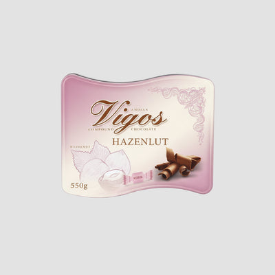 Pink chocolate tin with 'Vigos' branding on a white background