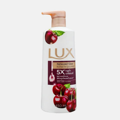 Lux body wash bottle with cherry graphics on a purple background