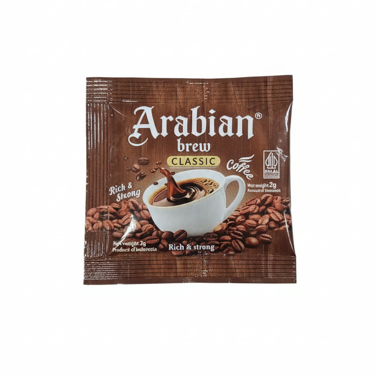 Multiple packages of Arabian Brew coffee on a wooden surface