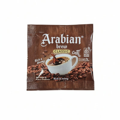 Multiple packages of Arabian Brew coffee on a wooden surface