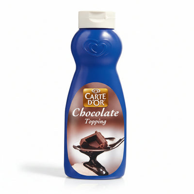 A blue squeeze bottle of Carte d'Or Chocolate Topping with a white cap, shown against a plain white background.