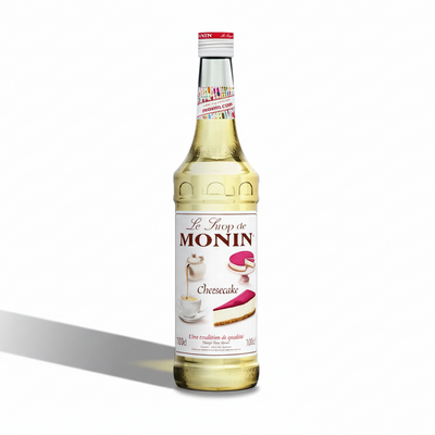 Bottle of Monin chocolate syrup on a white background