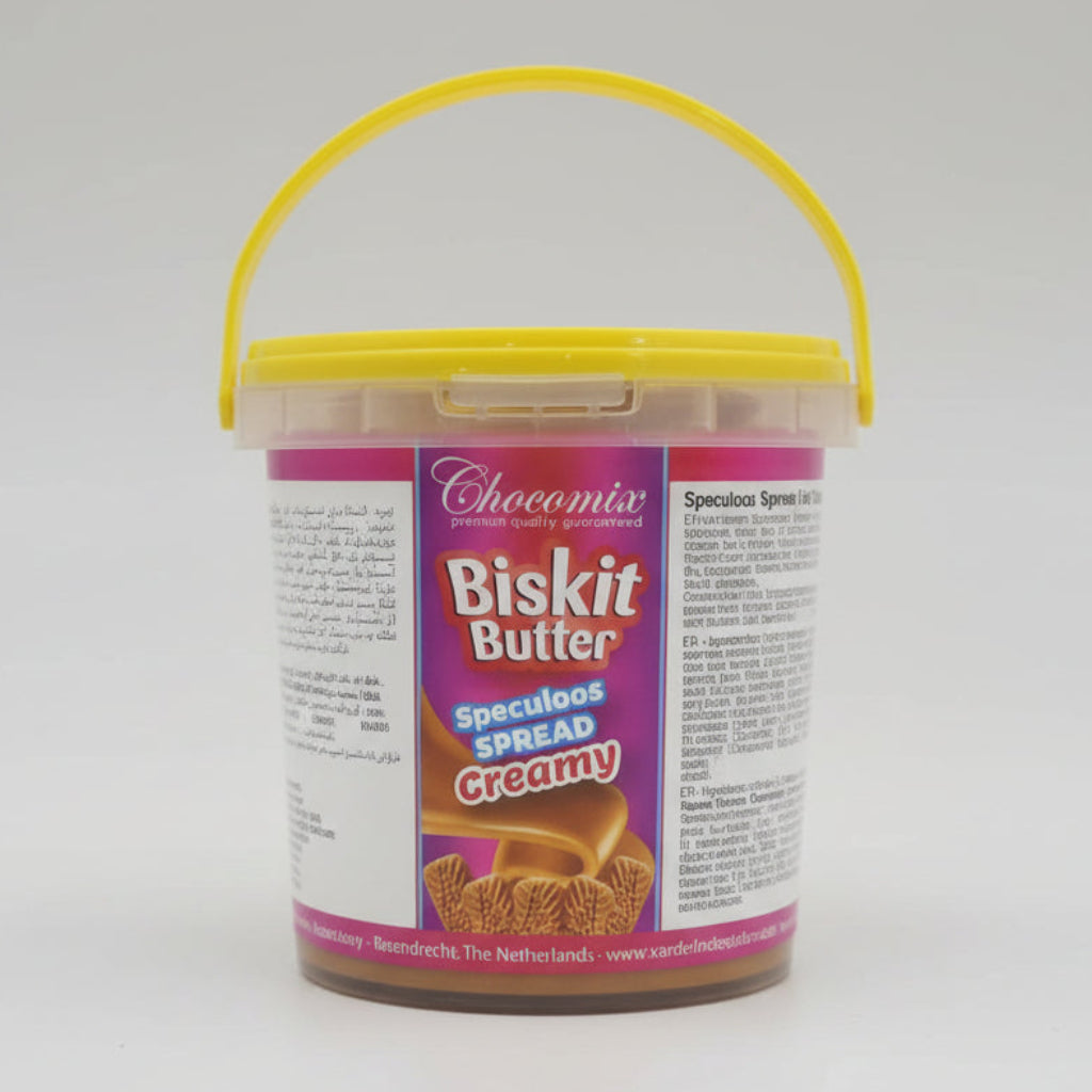 Container of Biskit Butter Speculoos Spread Creamy with a yellow lid held by a hand.