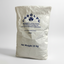 Bag of Corolac instant filled milk powder on a white background