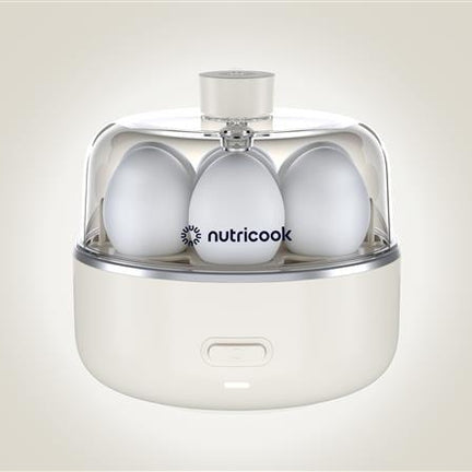Egg holder with three eggs inside on a light beige background, featuring the brand 'nutricook'.