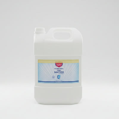 A large white plastic jug of Kingbii Antiseptal Hand Sanitizer sitting on a beige textured surface in an indoor setting.
