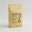 Bag of Iron Oxide Yellow pigment with packaging details on a gray background