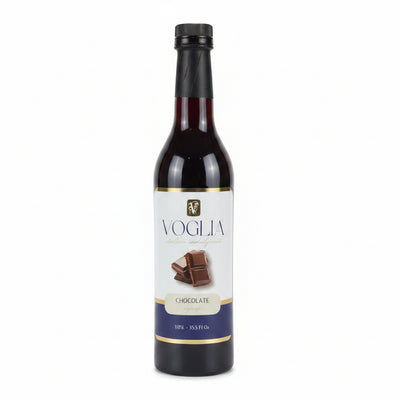 Two bottles of Voglia syrup, one salted caramel and one chocolate, on a white surface.