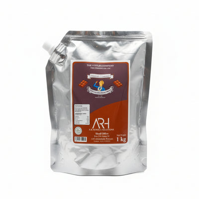 Hand holding a large silver package with a red label on a tiled floor.